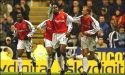 Sol Campbell and Arsenal celebrate the second at St.James