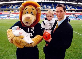 Me and Ethan with Bolton's 'Lofty' holding the new arrival. - Click to enlarge